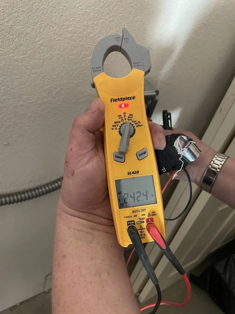 Voltage testing with clamp meter during Electrical Installation Services in Tallmadge